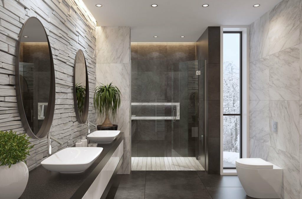 contemporary minimalist bathroom with two oval mirrors and black frame.
natural stacked white matte stone wall and large marble matte tiles.
two rectangular white wash basins are on top of the long black glossy cabinet with
white doors. large grey matte floor tiles. walk-in shower with large marble tiles 
and inox shower panel,ceiling strip cove lighting with embedded spotlights.
white towel radiator on white marble wall.